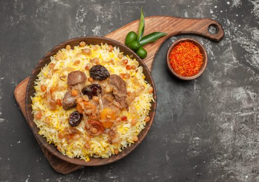 top-close-up-view-pilaf-pilaf-citrus-fruits-board-bowl-spices